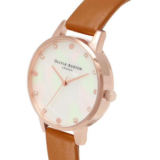 A brown leather watch with a white face, gold accents, and a small diamond-like pattern on the face