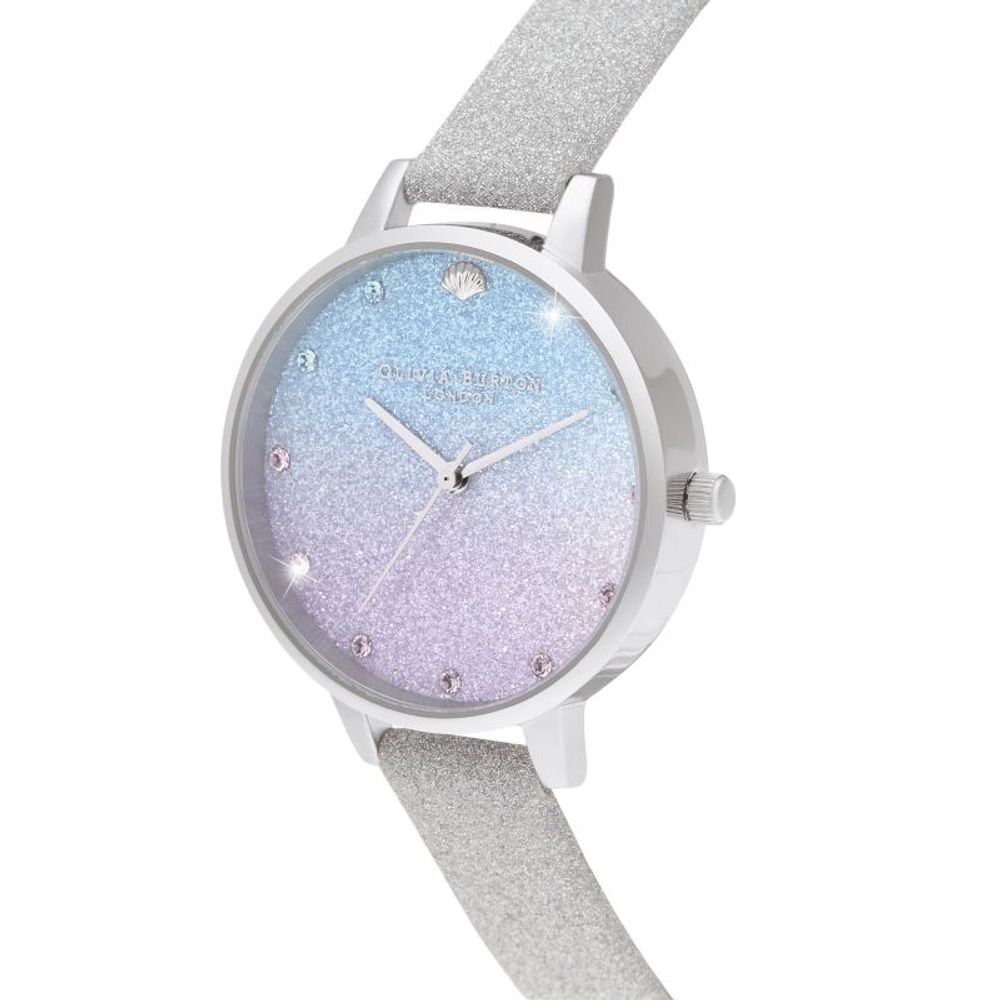 A gray artificial leather watch with a blue and pink glittery face, featuring diamond-like embellishments