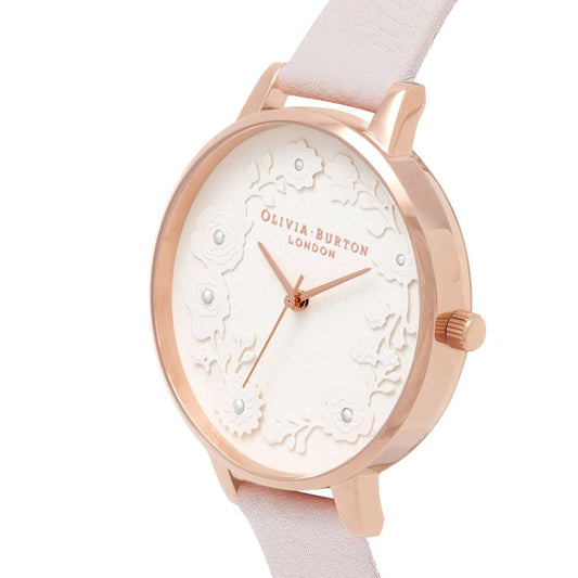 Pink watch with floral pattern on face, gold hands, and multicolored strap