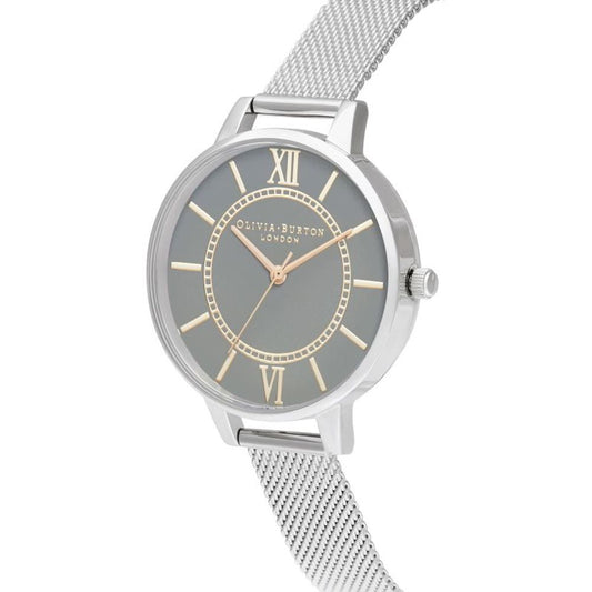 A silver stainless steel watch with a gold face, featuring Roman numerals and hands