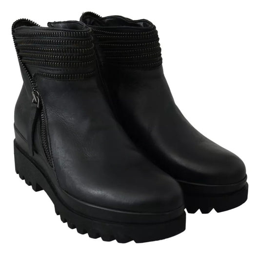 Pair of black leather boots with chunky heels