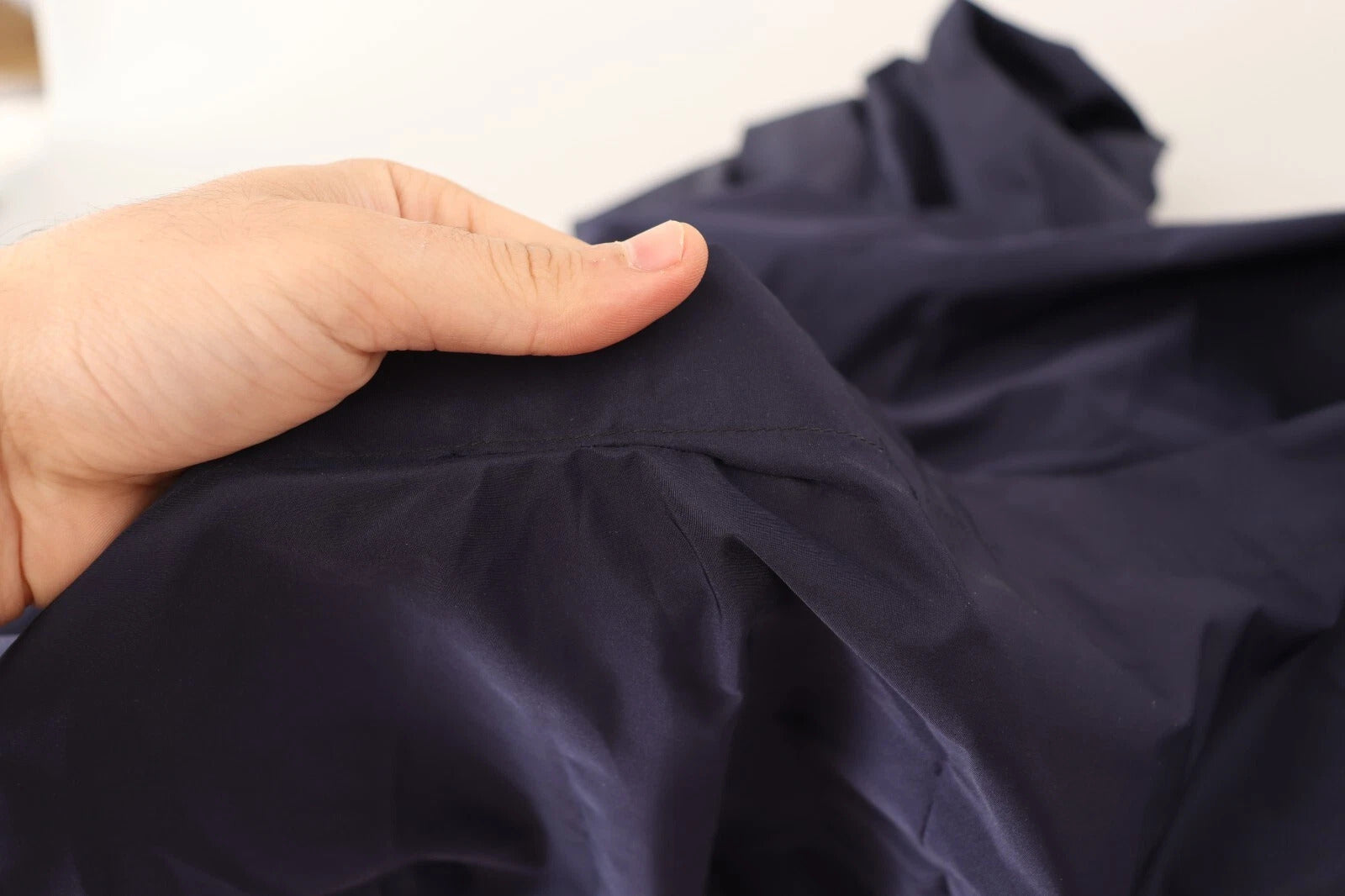 Navy blue sleeveless round neck mermaid long dress with visible seams and wrinkles on fabric