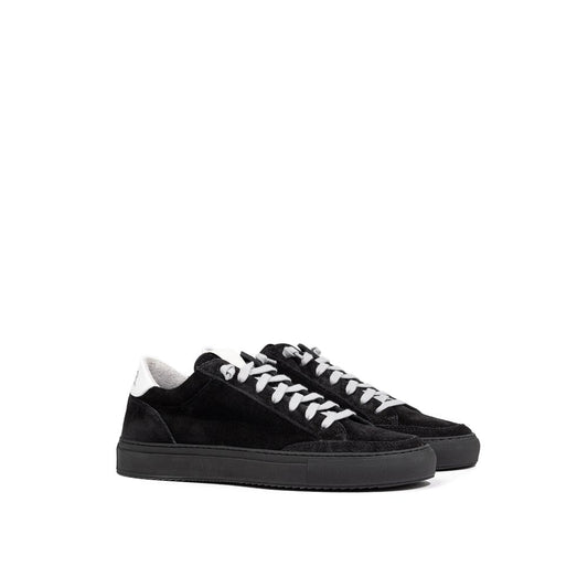 Pair of black sneakers with white laces and soles