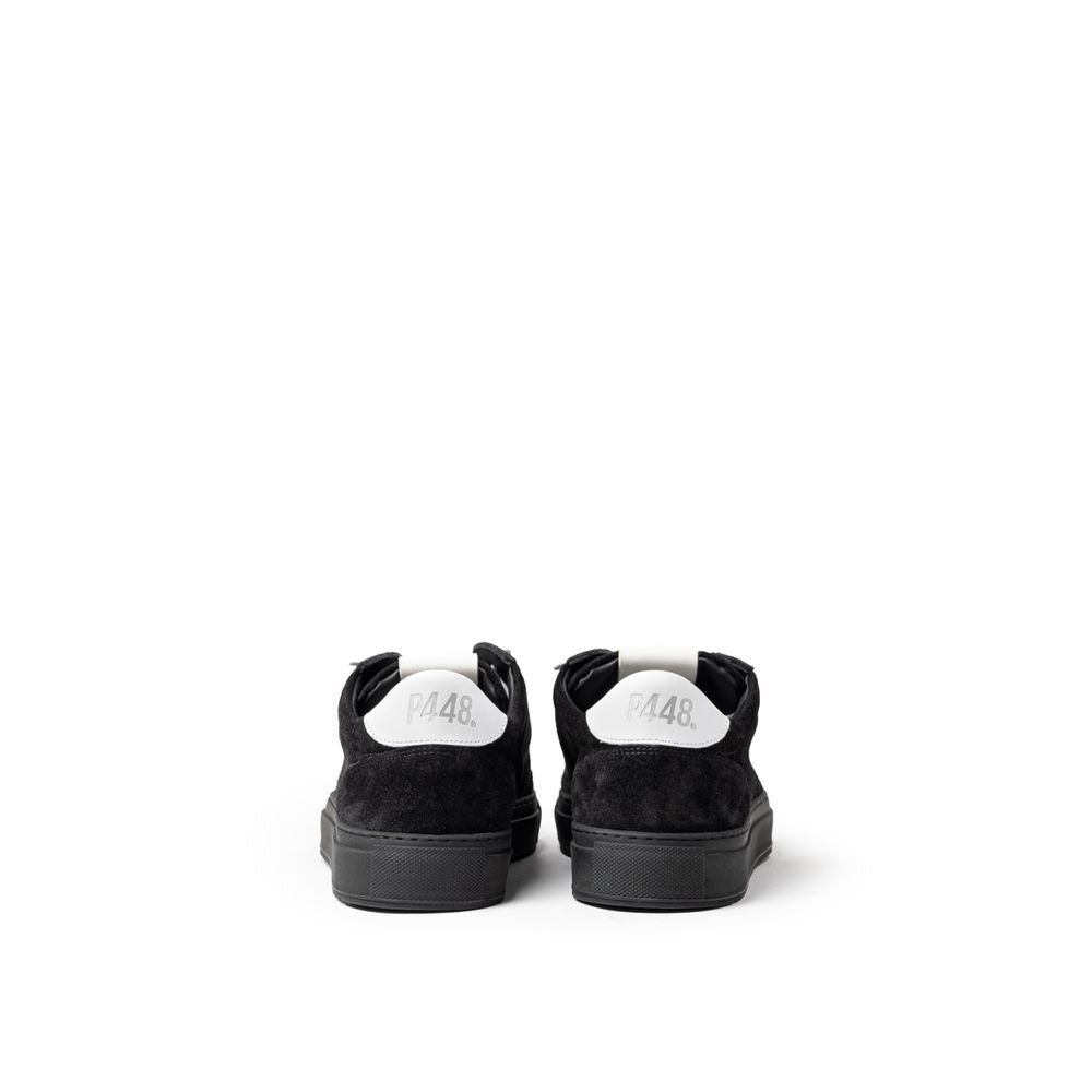 Pair of black and white sneakers with laces