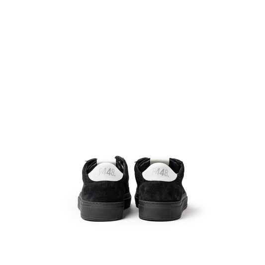 Pair of black and white sneakers with laces