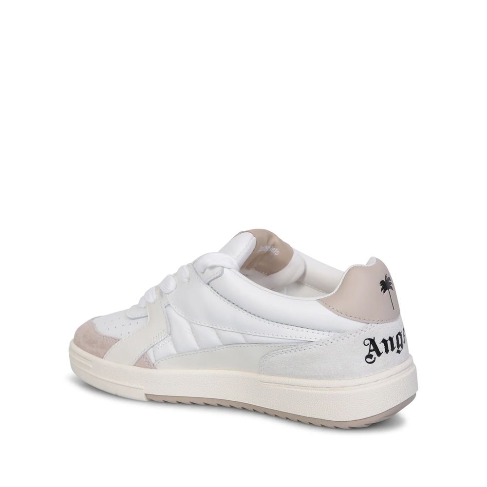 Pair of white sneakers with tan soles, featuring a logo on the side and a textured design on the upper