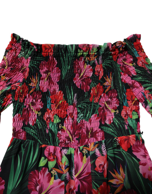 Pink floral print jumpsuit dress with ruffled sleeves and neckline