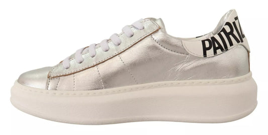 Silver high top sneaker with white laces and a black logo on the side