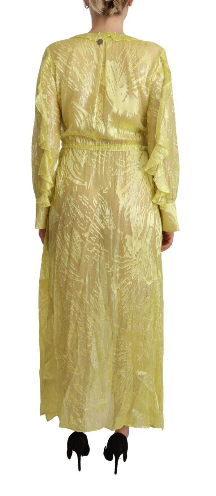 A long yellow silk dress with long sleeves and plunging neckline
