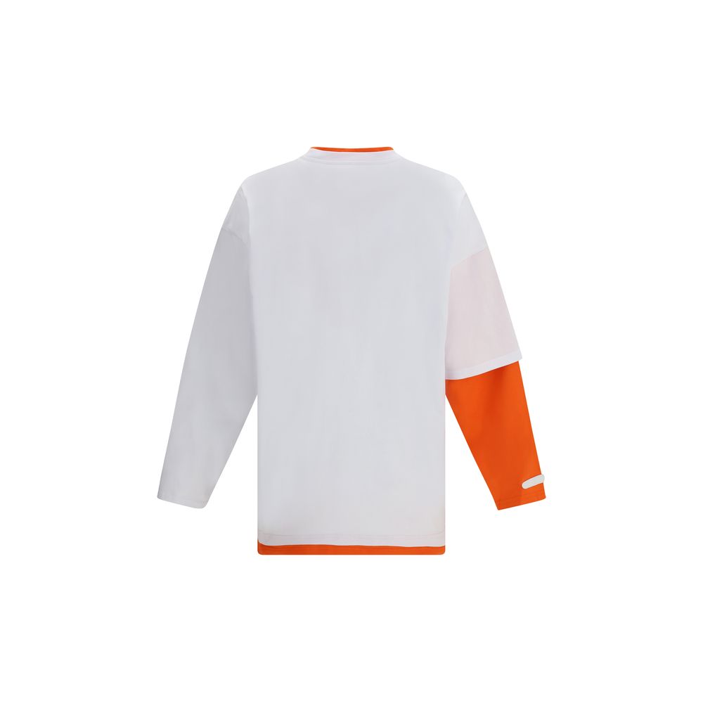 A white long sleeve t-shirt with orange accents on the shoulders and sides