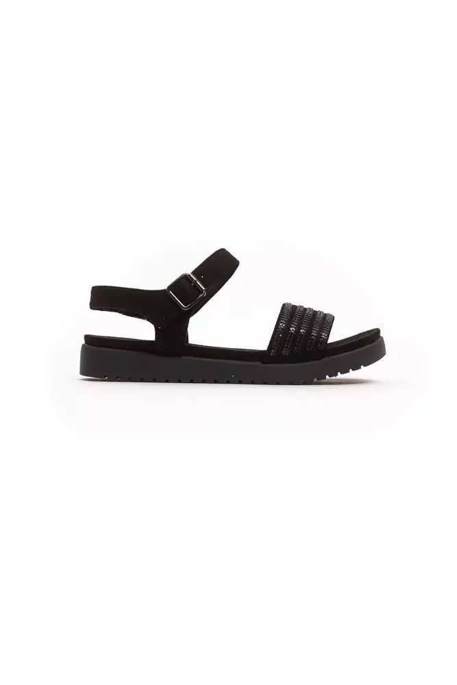 Black sandal with strap over foot and heel