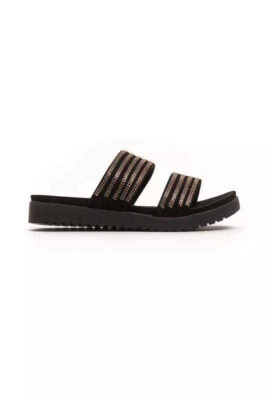 Pair of black sandals with gold straps and a flat sole