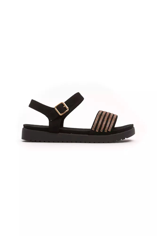 Black sandal with gold accents and a strap over the foot