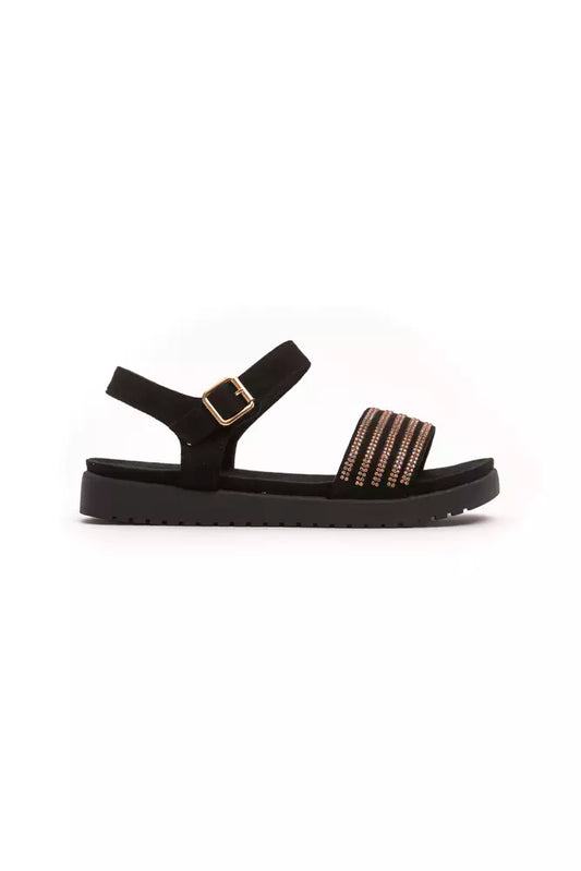Black sandal with gold accents and a strap over the foot