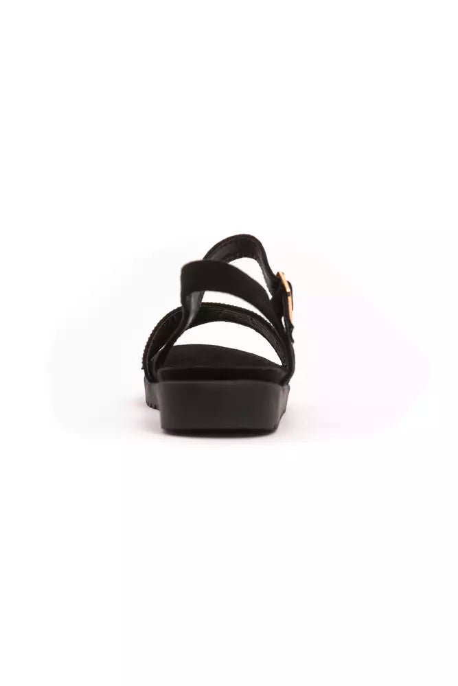 Black strappy sandal with a chunky heel and ankle strap