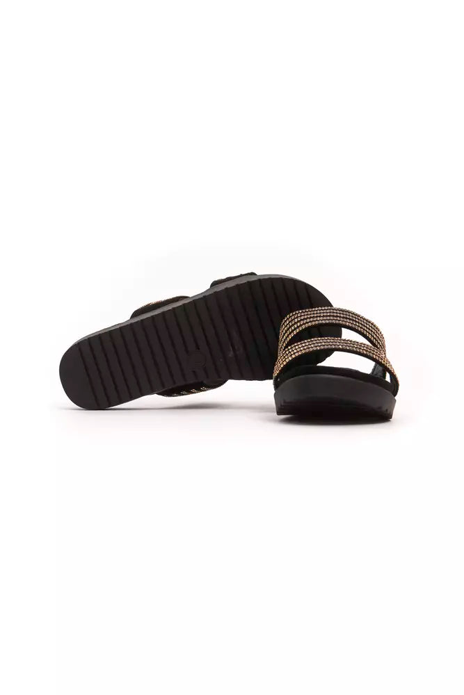 Pair of black and gold flip flops with straps