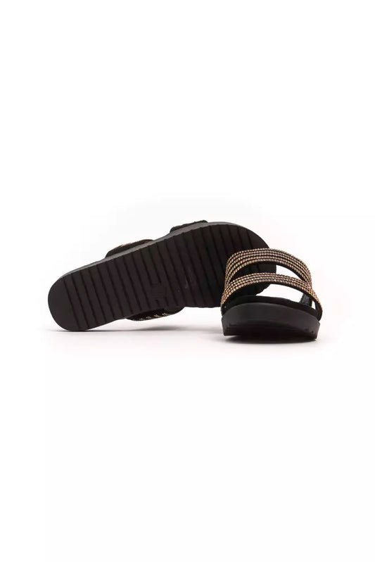 Pair of black and gold flip flops with straps