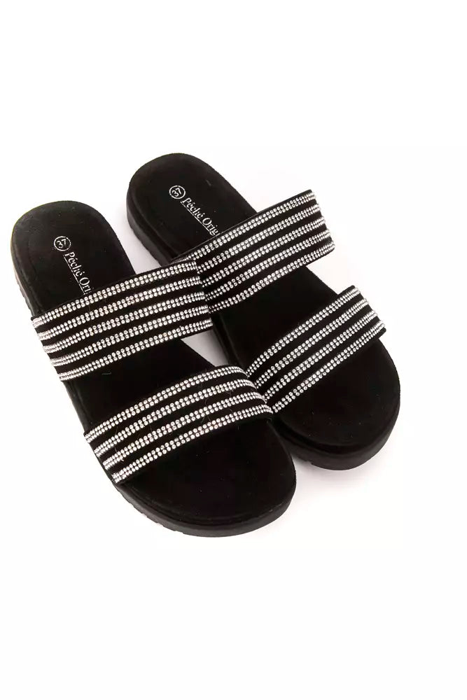 Pair of black velvet sandals with silver straps and buckles