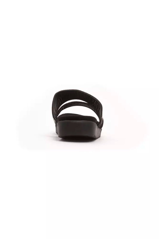 Black sandal with strap over foot and ankle