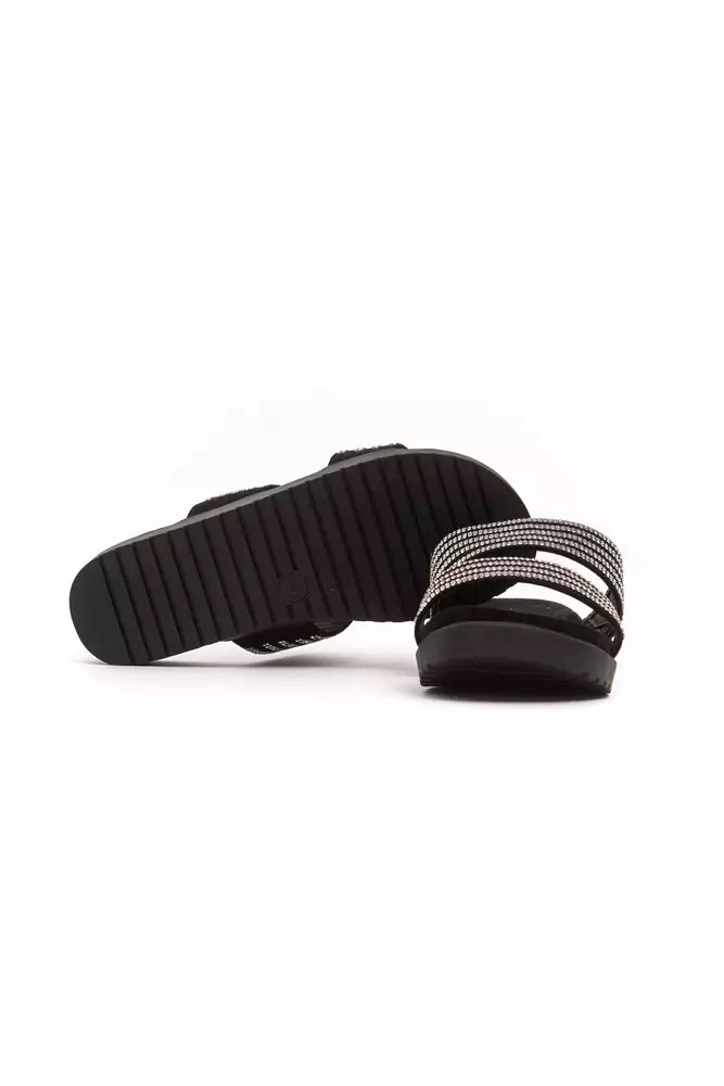 Pair of black shoes with white soles and laces