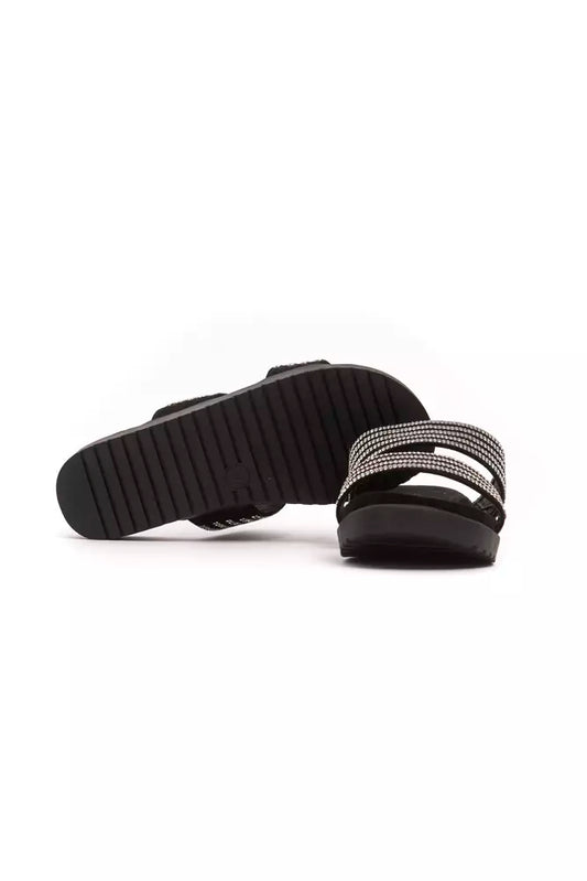 Pair of black shoes with white soles and laces