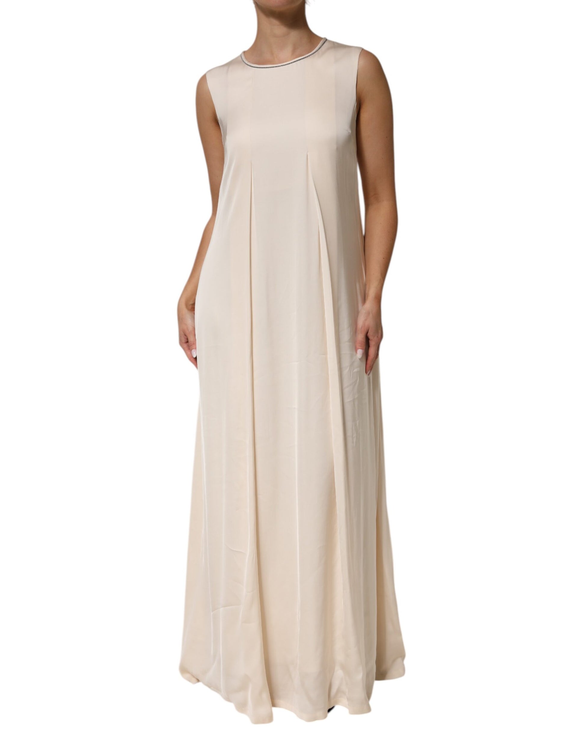 A long, beige viscose dress with pleats and no sleeves
