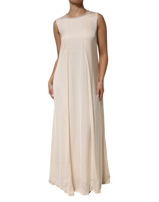 A long, beige viscose dress with pleats and no sleeves