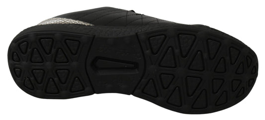 Pair of black hiking shoes with white sole and patterned treads