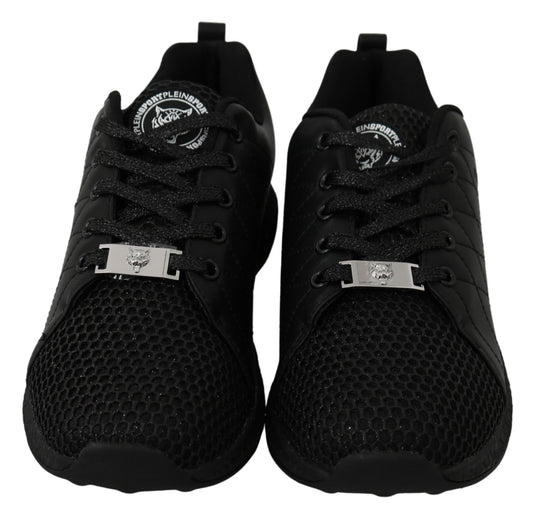 Pair of black sneakers with a silver buckle on the side