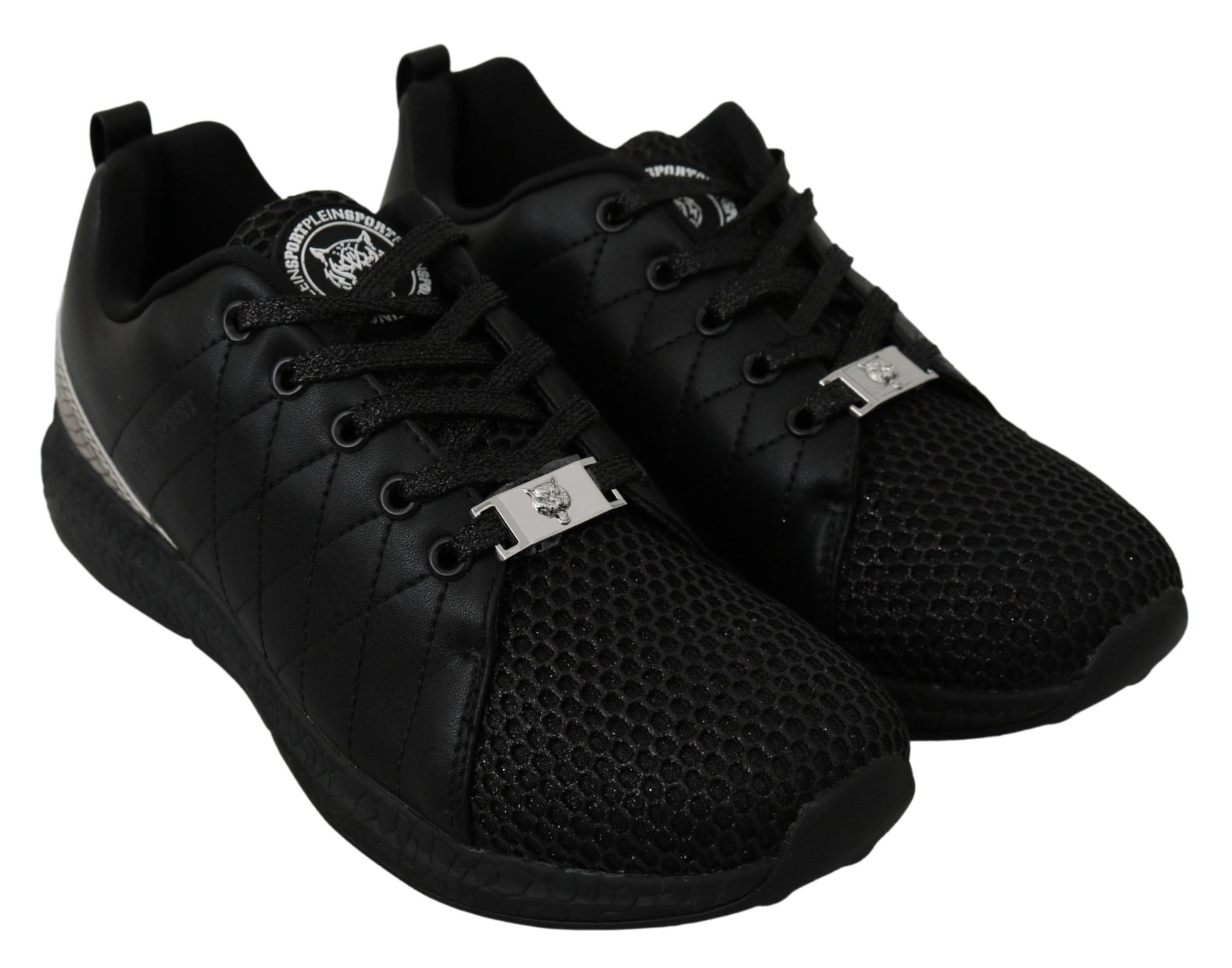 Pair of black sneakers with white laces and a silver buckle on each side