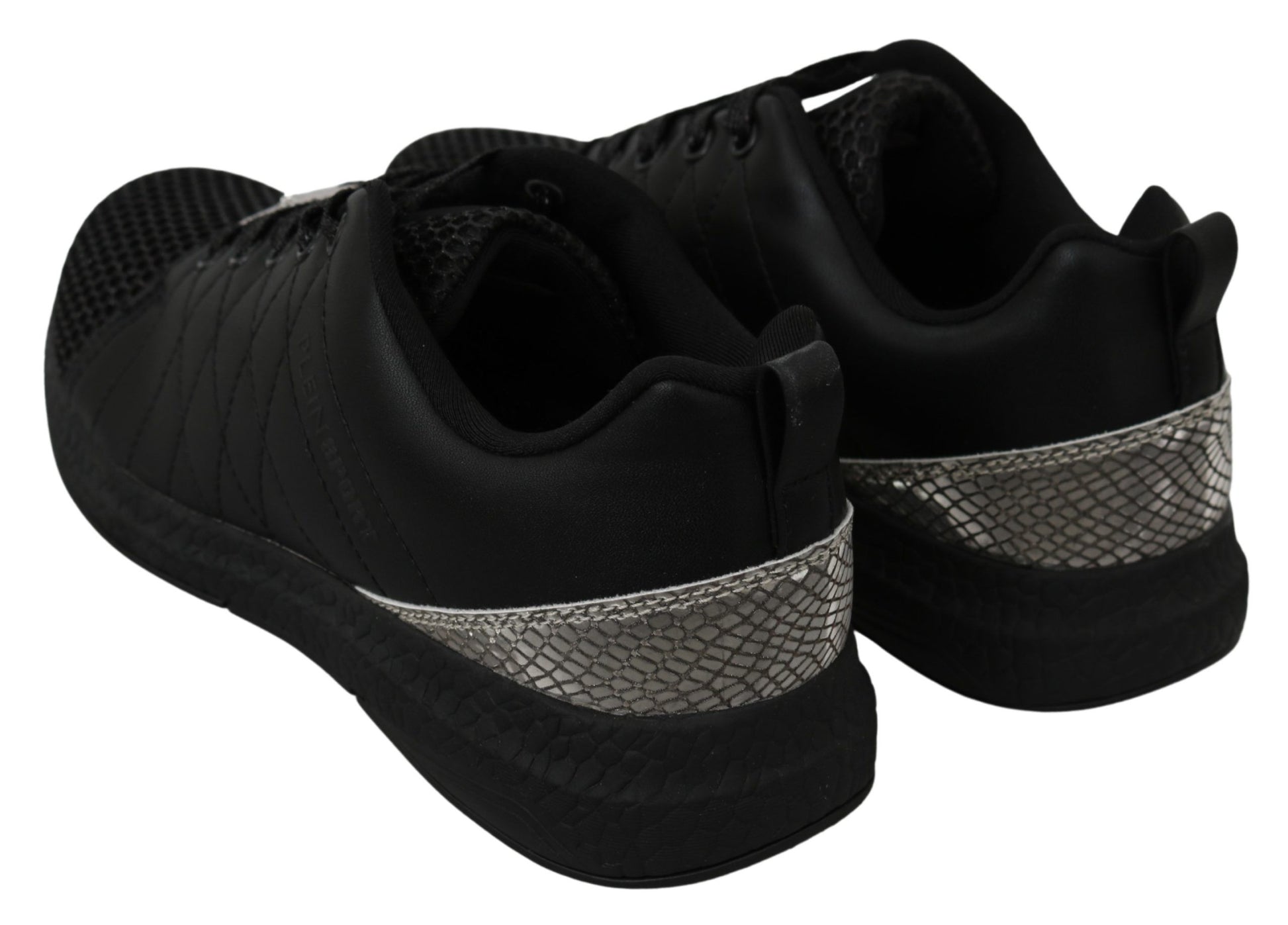 Pair of black sneakers with silver accents and a knit texture