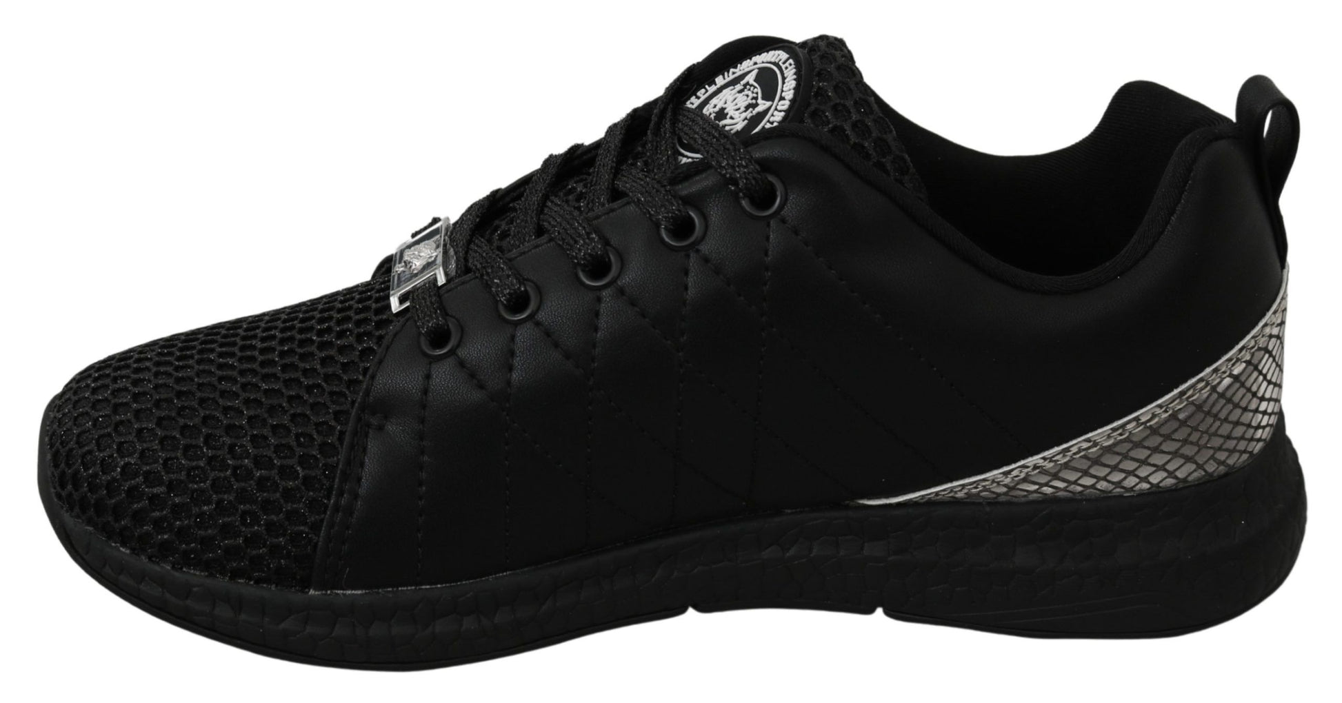Black and white sneakers with laces and a logo on the side