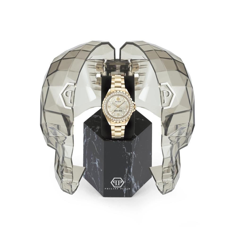 A gold stainless steel watch with a diamond face, set in a black box with a marble-like design