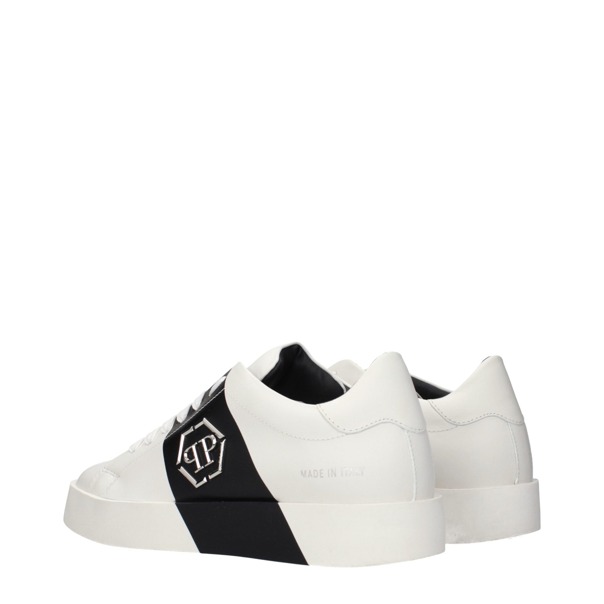 Pair of white leather sneakers with black laces, featuring a black and white checkered pattern on the side