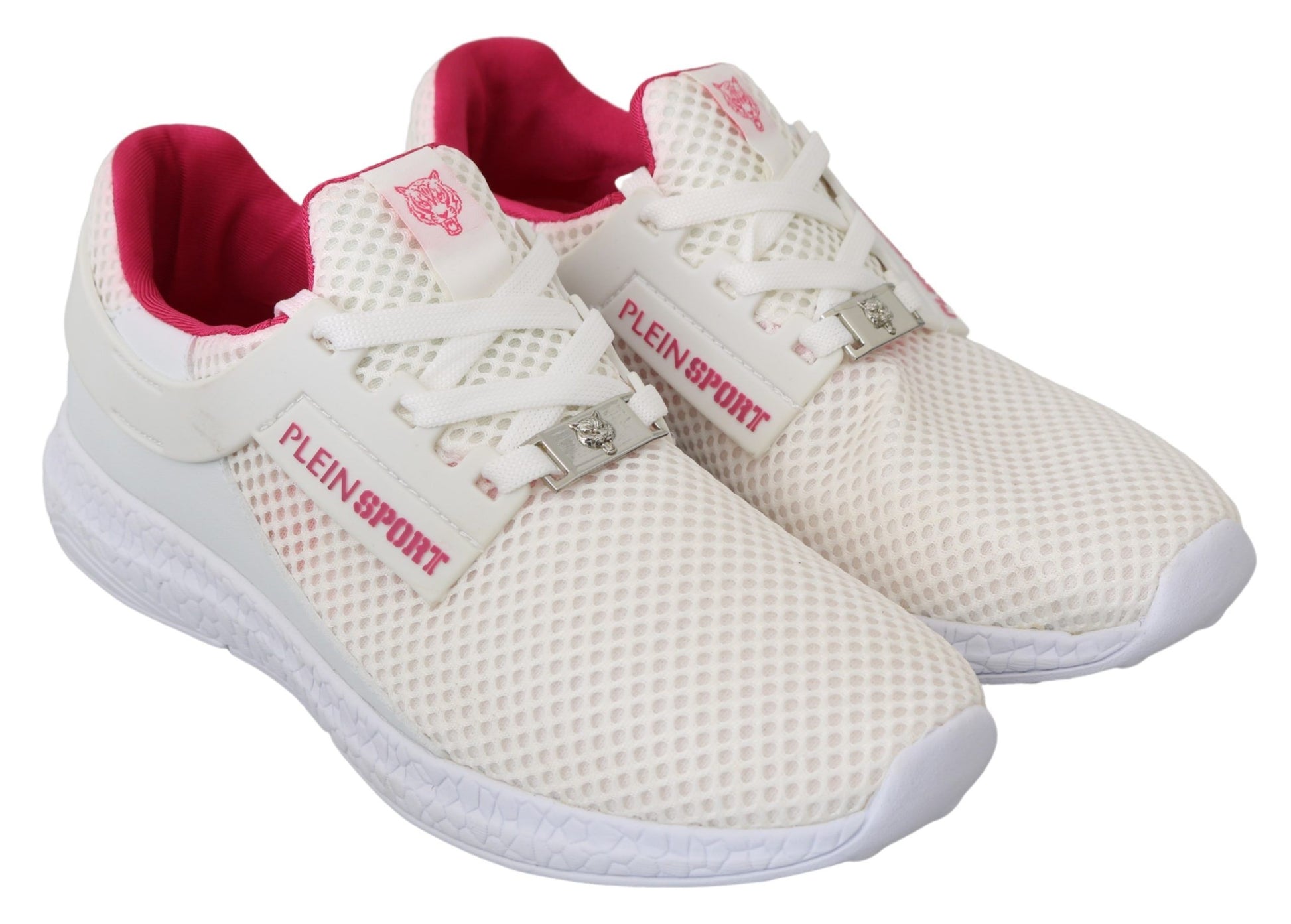 Pair of white sneakers with pink accents and laces