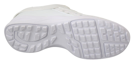 White athletic shoe with cleats on bottom