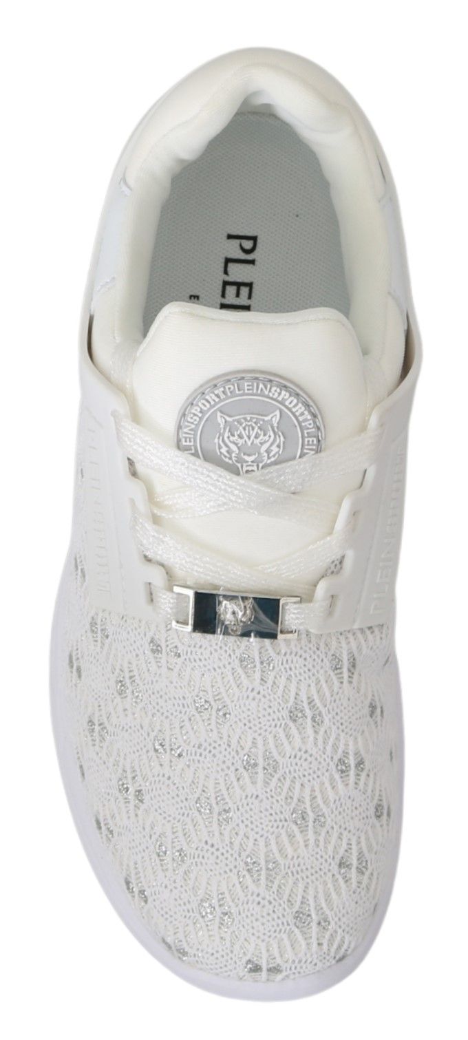 White sneaker with laces and a logo on the tongue