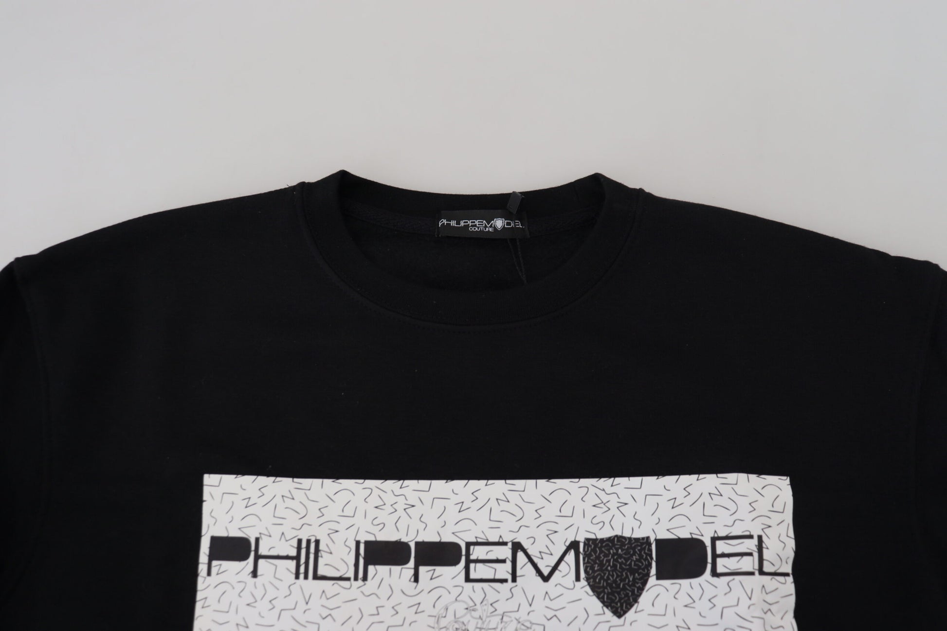 Black t-shirt with white lettering on front