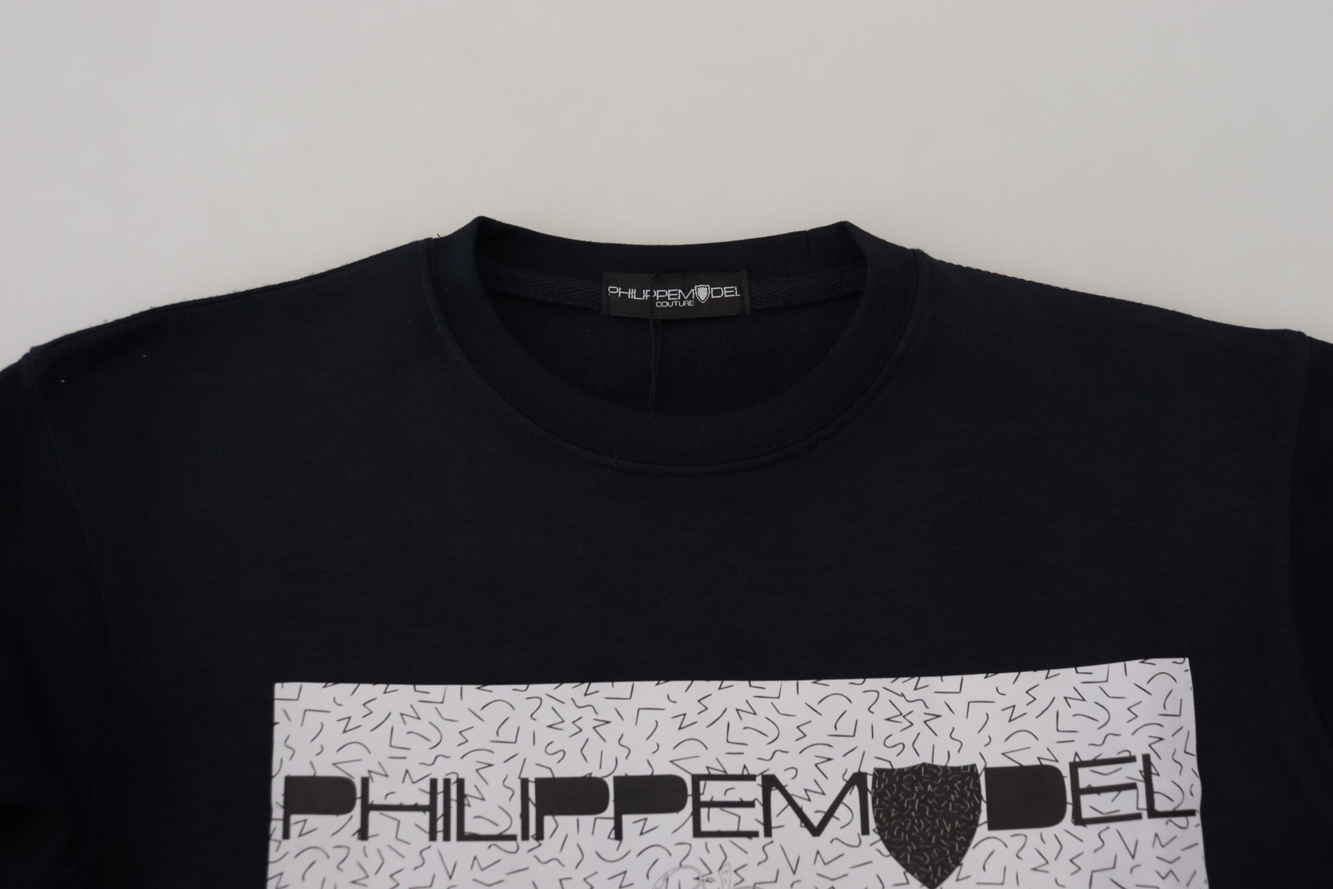 Black t-shirt with white lettering on front