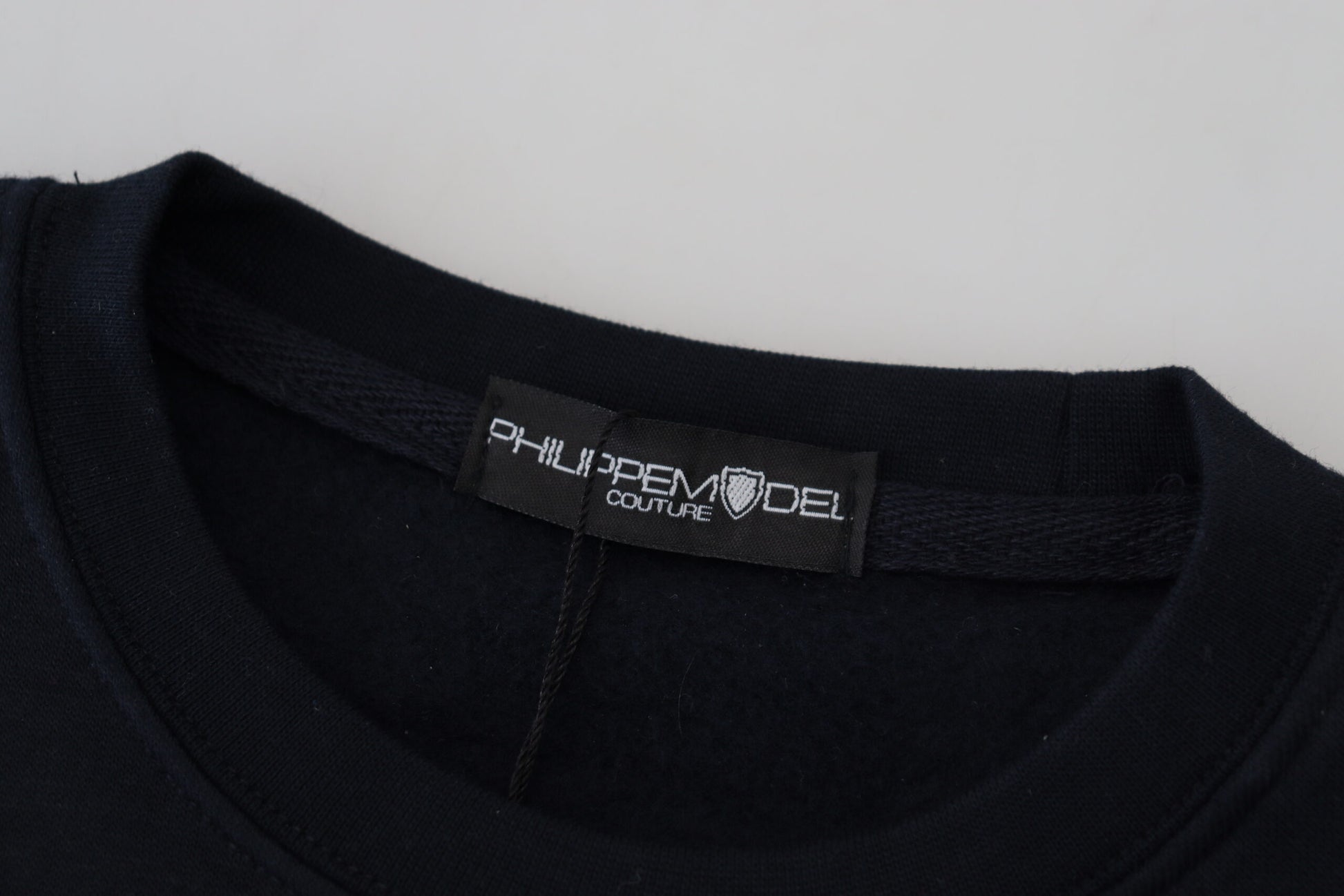 Black t-shirt with white label on neck