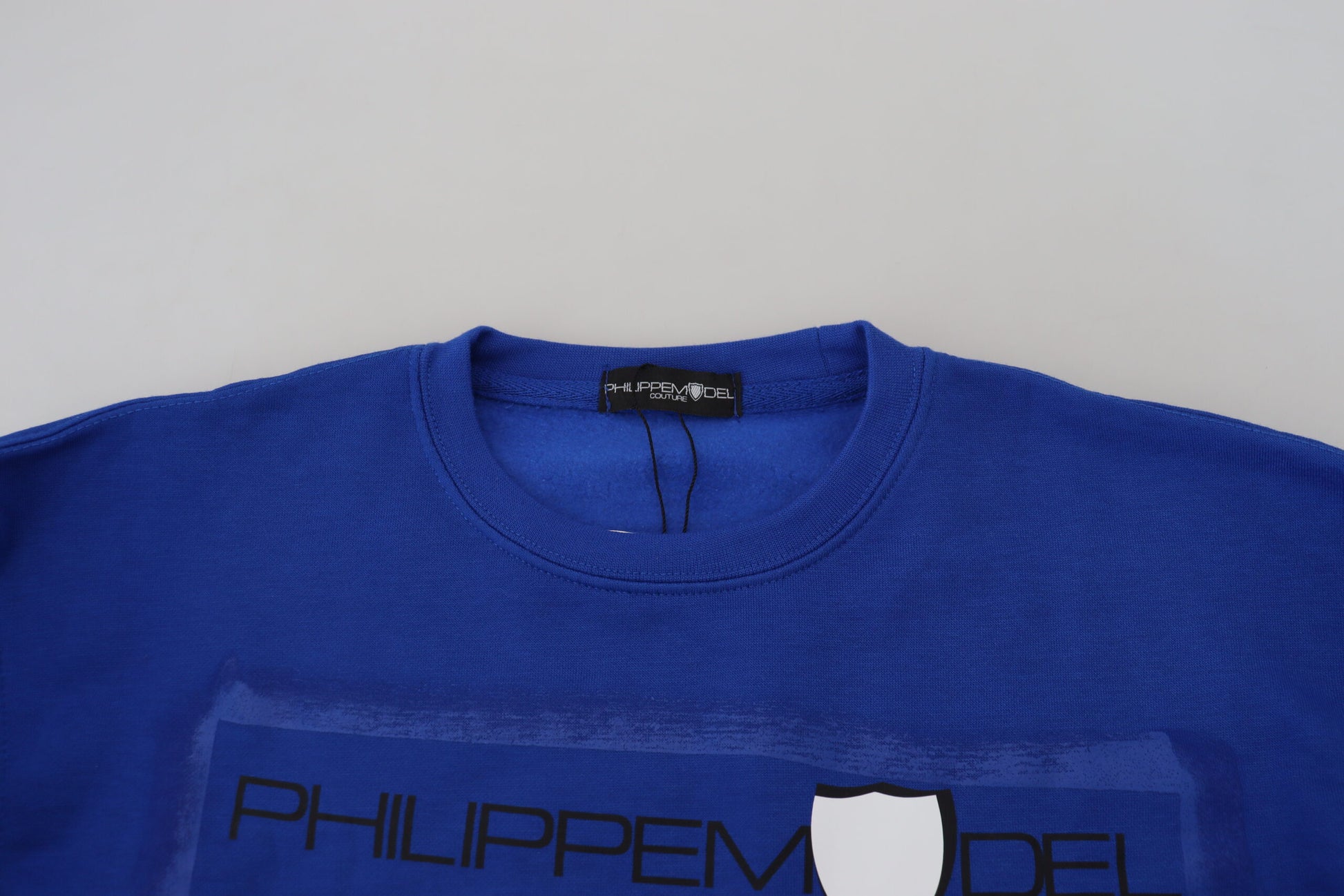Blue sweatshirt on hanger