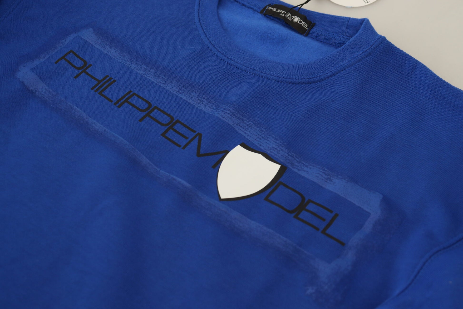 Blue t-shirt with white lettering