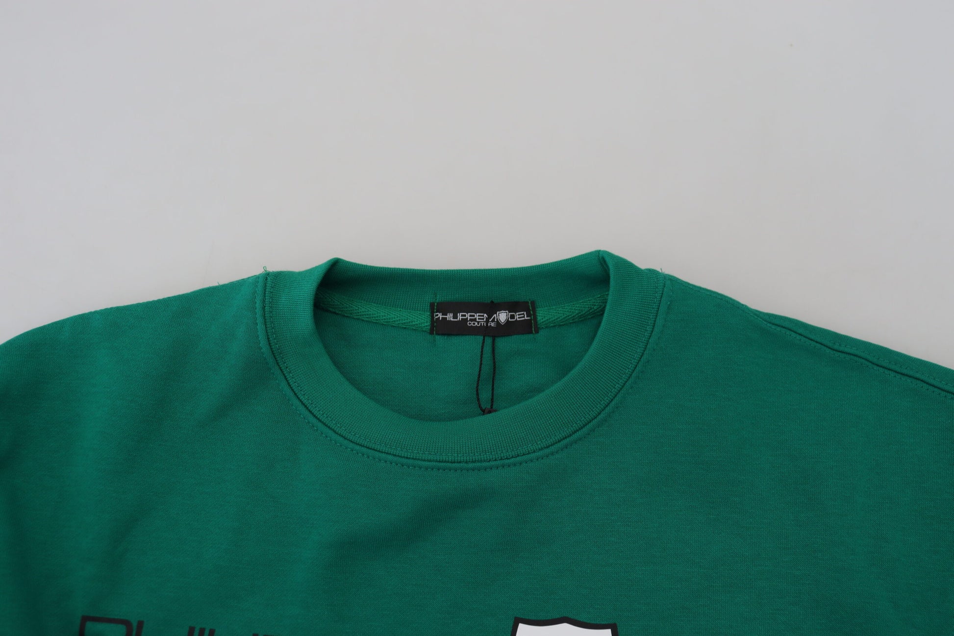 Green sweater on hanger