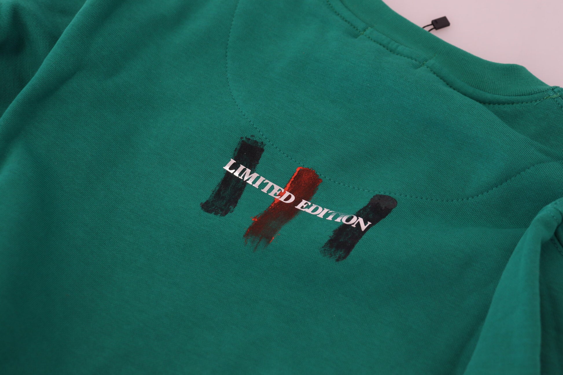 Green t-shirt with limited edition logo on front
