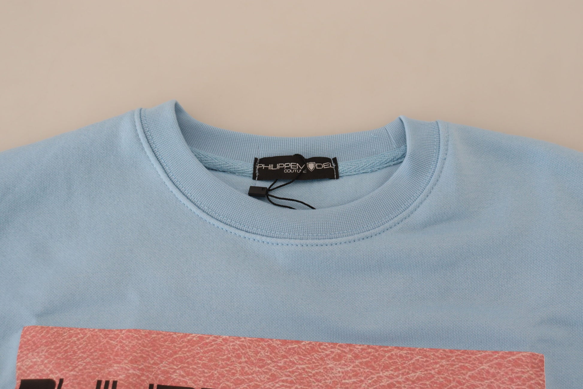 Blue sweater on hanger
