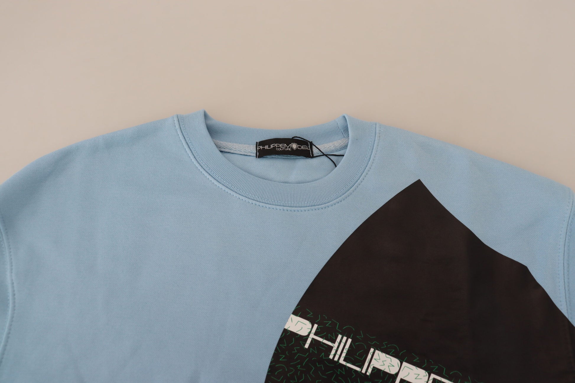Blue sweater on hanger