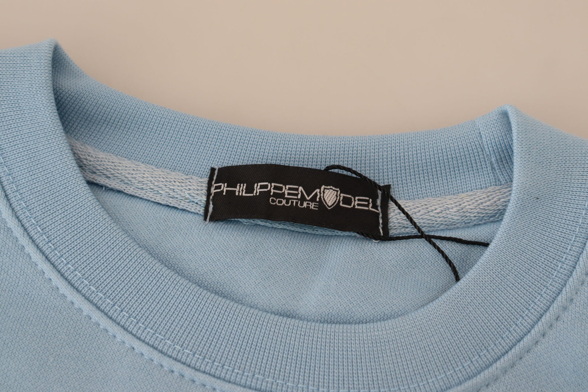 Blue t-shirt on hanger