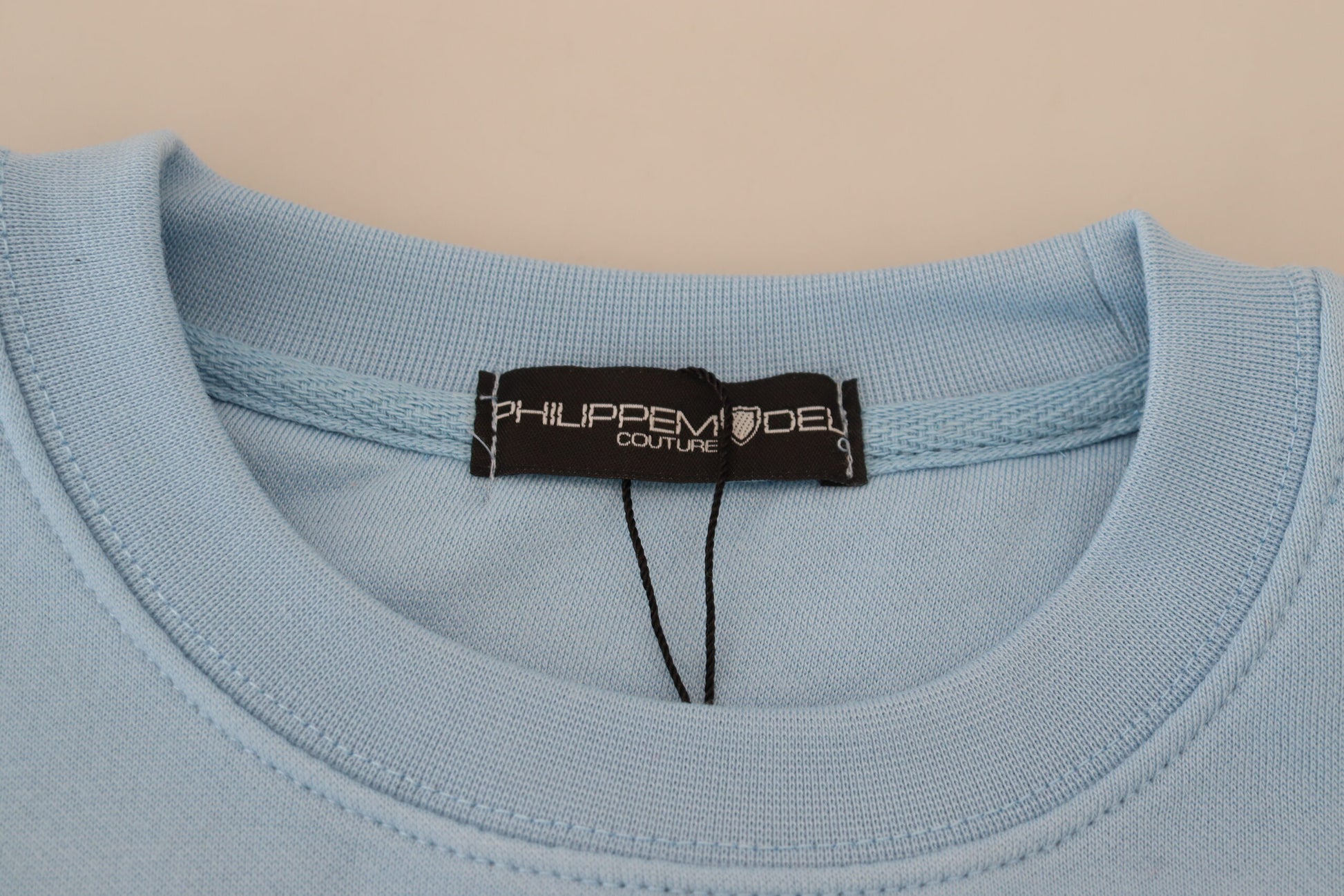 Blue shirt on hanger with tag