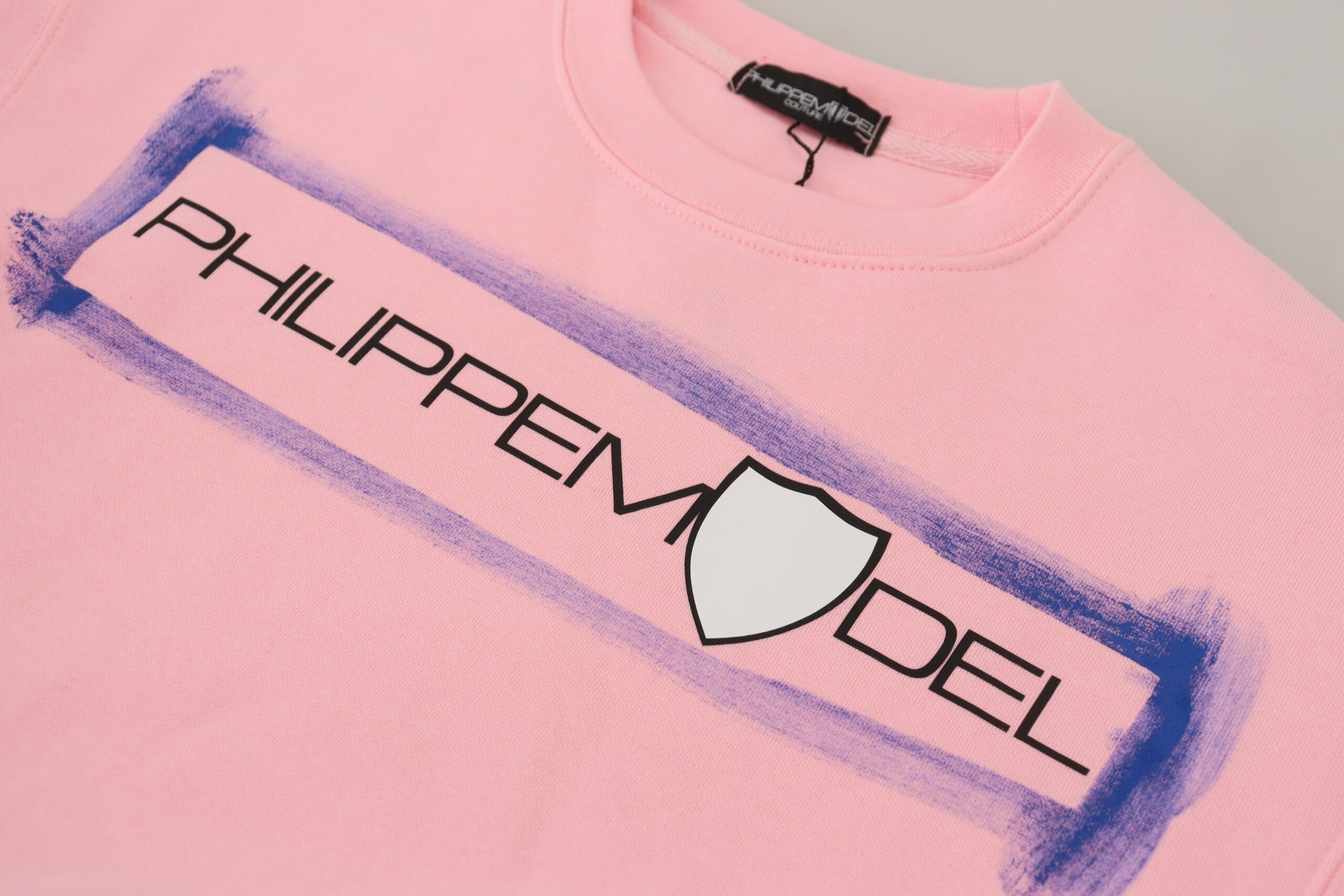 Pink sweatshirt with purple logo