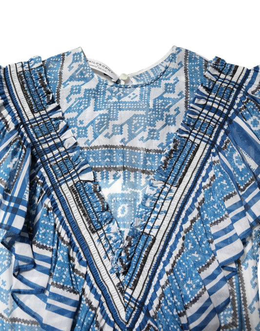Blue and white patterned garment with fringe details